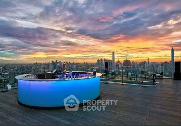 Stunning rooftop bar with panoramic city skyline views at sunset.