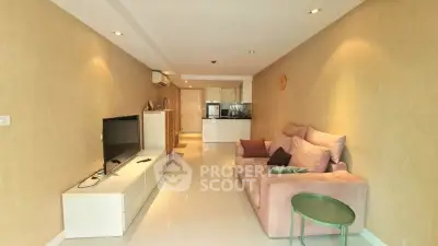 Spacious living room with modern decor and open layout in a stylish apartment.