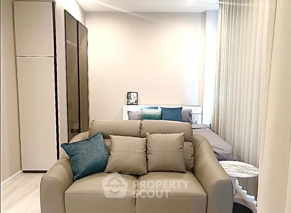 Modern studio apartment with cozy living area and stylish decor