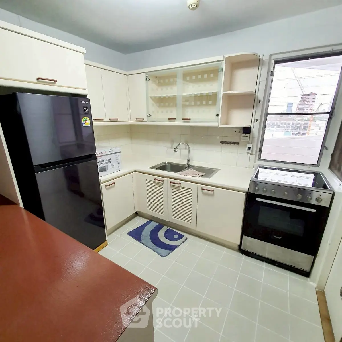 Charming kitchen with modern appliances and ample storage space.