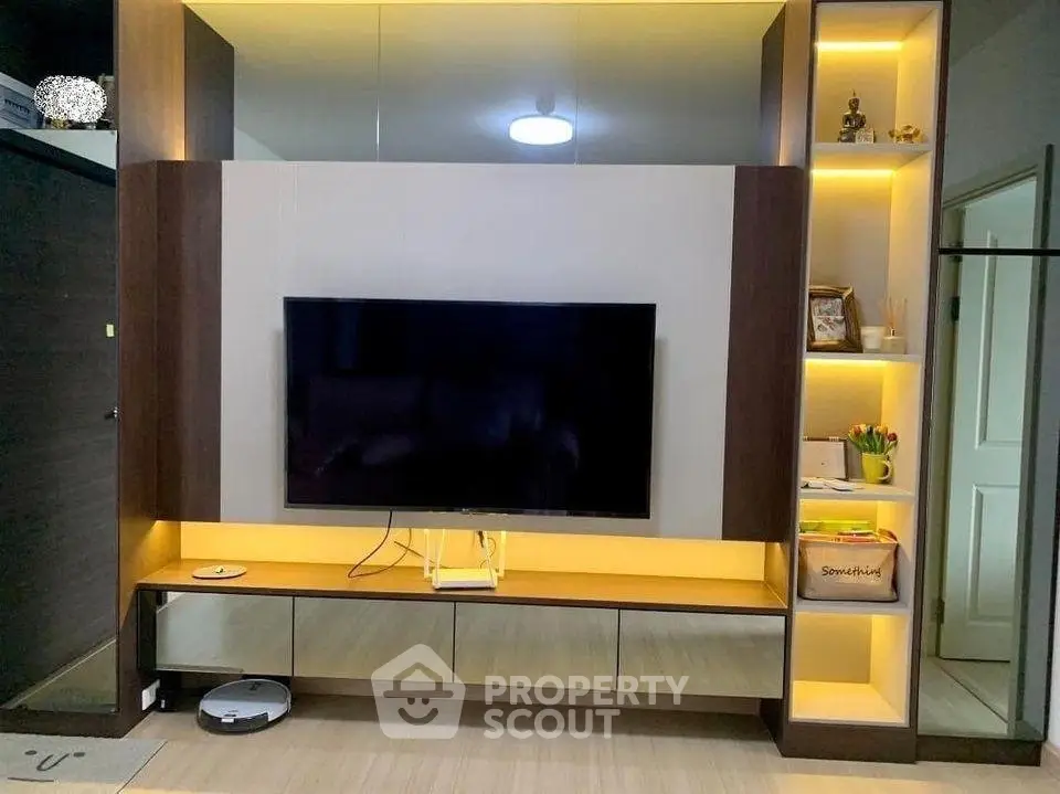 Modern living room with sleek TV unit and ambient lighting