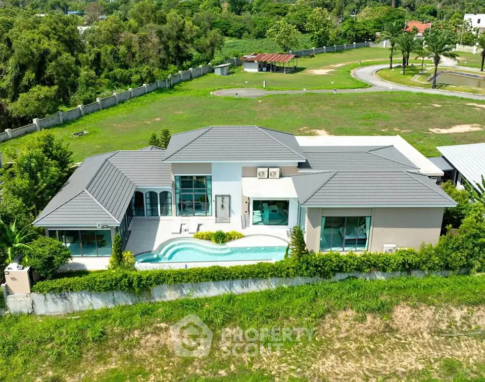 Luxurious modern villa with private pool and lush greenery