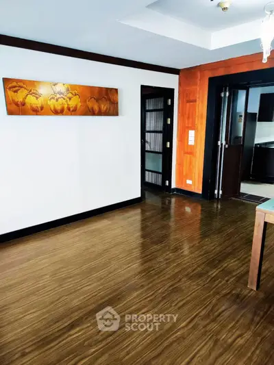 Spacious living room with wooden flooring and modern decor