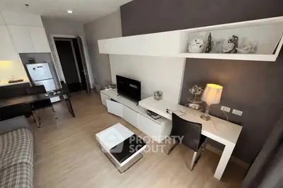 Modern living room with stylish furniture and open kitchen layout