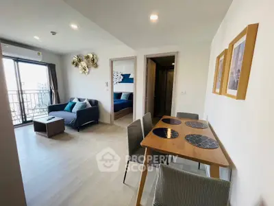 Modern living room with dining area and balcony access in stylish apartment
