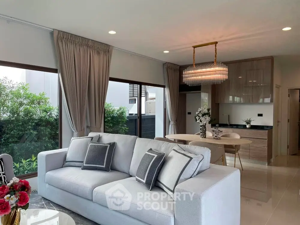 Luxurious modern living room with elegant decor and open kitchen layout