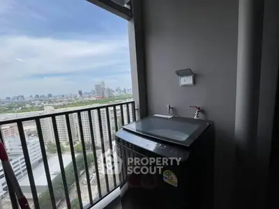 High-rise balcony with washing machine and stunning city view
