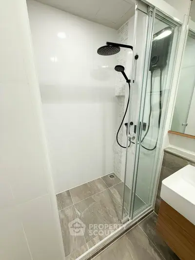 Modern bathroom with sleek shower and elegant fixtures