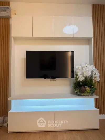 Modern living room with sleek TV unit and elegant decor