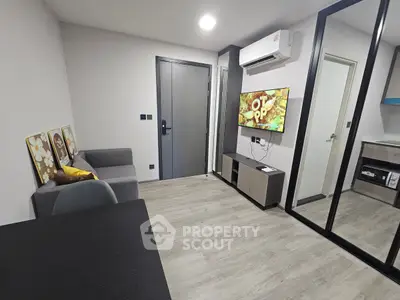 Modern living room with sleek design and wall-mounted TV