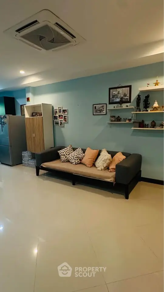 Spacious living room with modern decor and cozy seating area