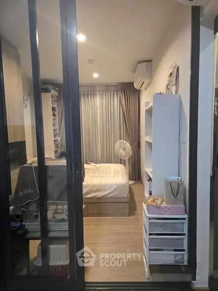 Cozy bedroom with modern decor and ample storage space