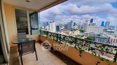 Spacious balcony with stunning city skyline view, perfect for relaxation and entertaining.
