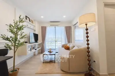 Chic and cozy living room with modern decor and natural light, perfect for relaxation and entertainment.