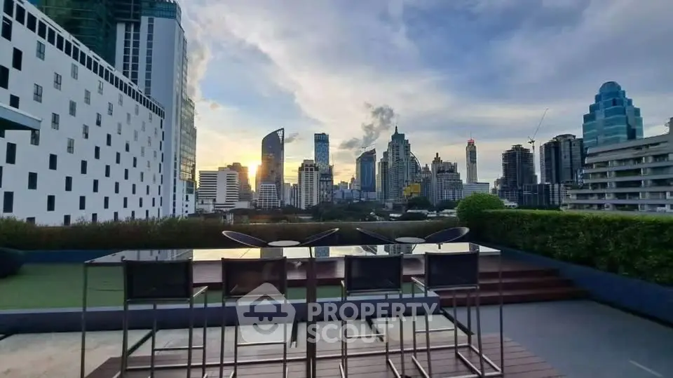 Stunning rooftop view with modern cityscape and elegant outdoor seating area.