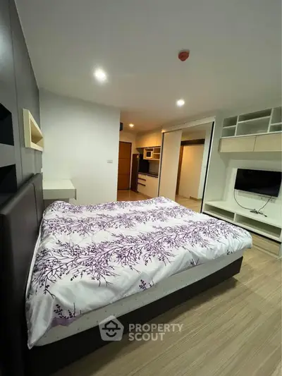 Modern bedroom with stylish decor and built-in storage solutions