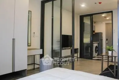 Modern apartment interior with glass partitions and in-unit laundry