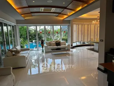 Luxurious living room with pool view and elegant decor
