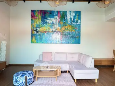 Modern living room with abstract art and stylish furniture
