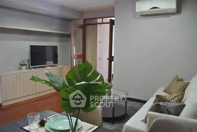Cozy living room with modern decor, air conditioning, and stylish furniture for comfortable living.
