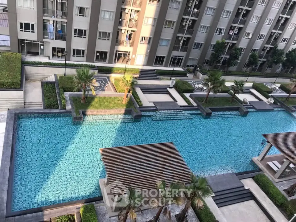 Luxurious apartment complex with stunning pool and landscaped gardens