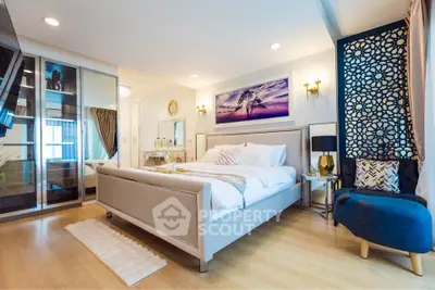 Luxurious bedroom with elegant decor and spacious layout, featuring a stylish bed and modern furnishings.