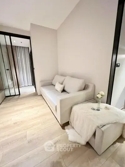 Cozy living room with modern sofa and elegant decor in a stylish apartment.