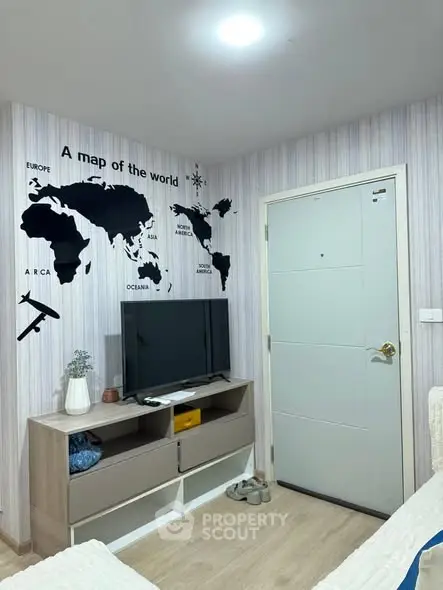 Modern living room with world map wall art and sleek TV setup