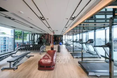 Modern gym with state-of-the-art equipment and panoramic windows.