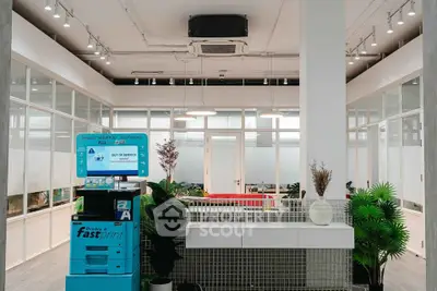 Modern office lobby with sleek design and vibrant greenery