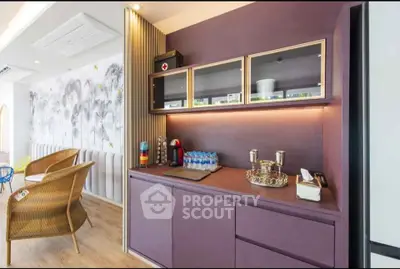 Stylish modern living room with elegant cabinetry and cozy seating area