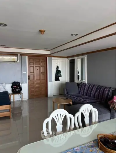Spacious living room with modern furniture and stylish decor in a contemporary apartment.