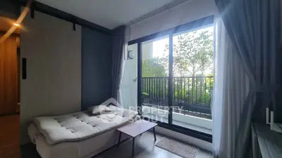 Modern living room with cozy sofa and balcony view