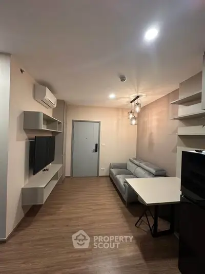 Modern living room with sleek furniture and ambient lighting, perfect for cozy evenings.