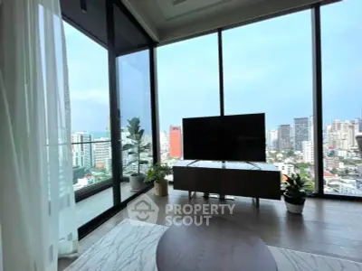 Luxurious living room with floor-to-ceiling windows offering stunning city views and modern decor.