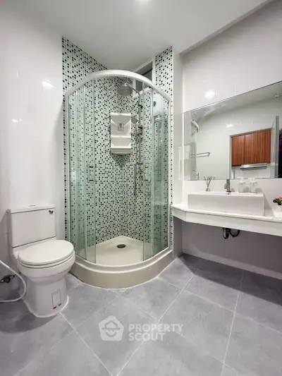 Modern bathroom with glass shower and sleek design