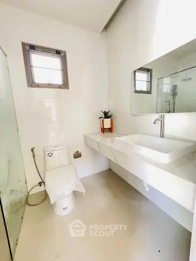 Modern bathroom with sleek design and large mirror