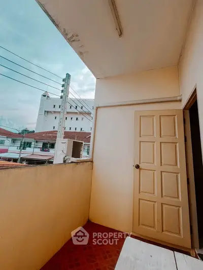 Charming balcony with urban view, perfect for relaxation and enjoying city life.