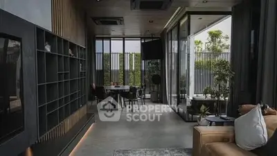 Luxurious modern living room with floor-to-ceiling windows and stylish decor