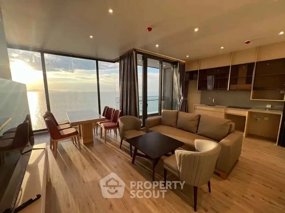 Stunning ocean view from modern living room with elegant furniture and open layout.