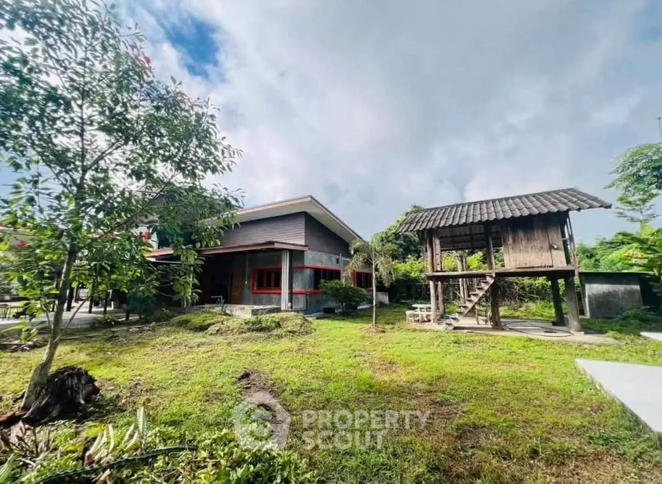 Charming rustic property with traditional wooden structure and lush garden, perfect for serene living.