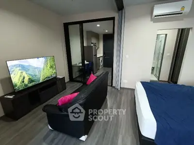 Modern studio apartment with open layout and sleek furnishings