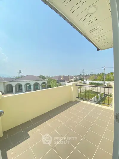 Spacious balcony with scenic view in a modern residential area, perfect for relaxation and outdoor enjoyment.
