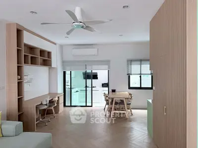 Modern living room with open layout, stylish furniture, and natural light, perfect for family gatherings.