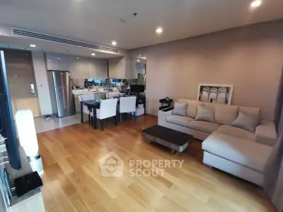 Spacious modern living room with open kitchen and elegant decor
