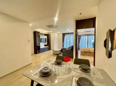 Modern open-plan living and dining area with stylish decor and natural light