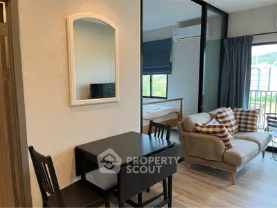 Modern apartment interior with cozy living area and dining space