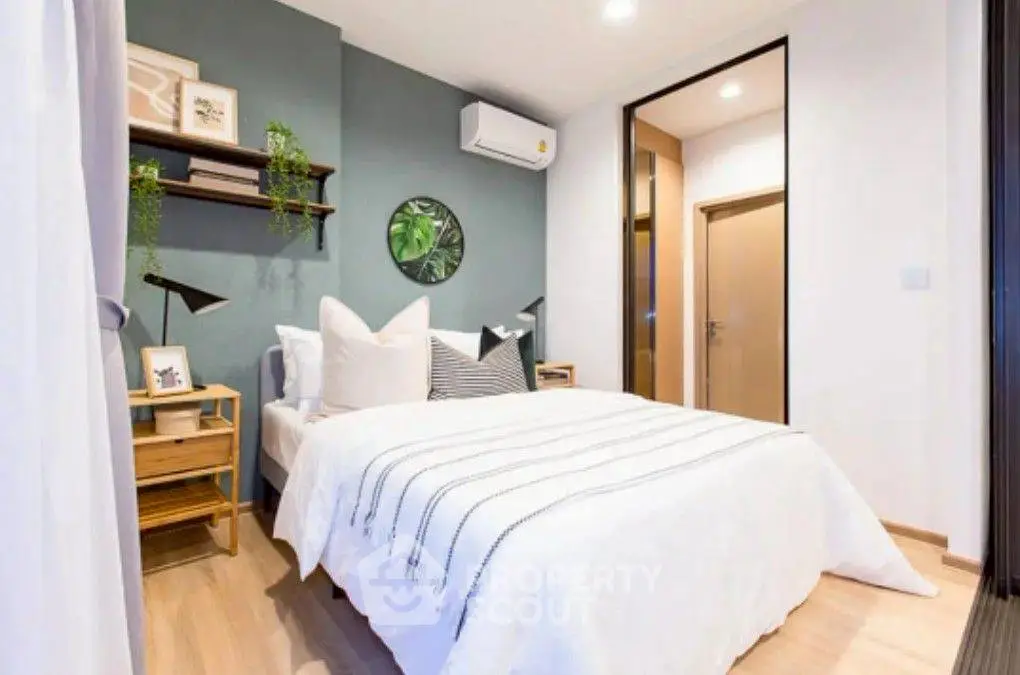 Modern bedroom with stylish decor and cozy ambiance, featuring a comfortable bed and elegant lighting.