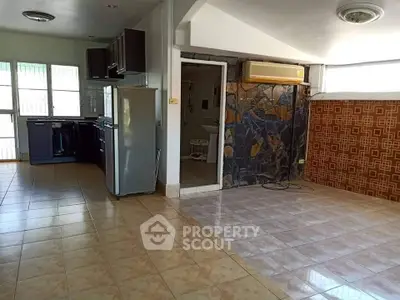 Spacious open-layout kitchen with modern appliances and tiled flooring