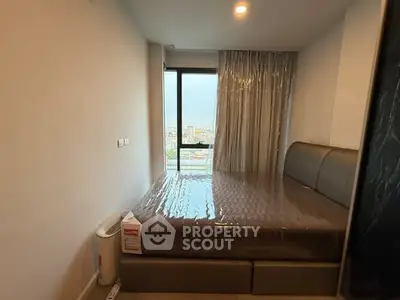 Cozy bedroom with large window offering stunning city view, modern bed, and elegant curtains.